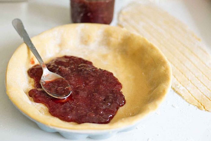 Italian style pastry tart with ricotta cheese and homemade strawberry jam from Rachel Roddy's cookbook Five Quarters. Photography by Giulia Mule (Mondomulia)