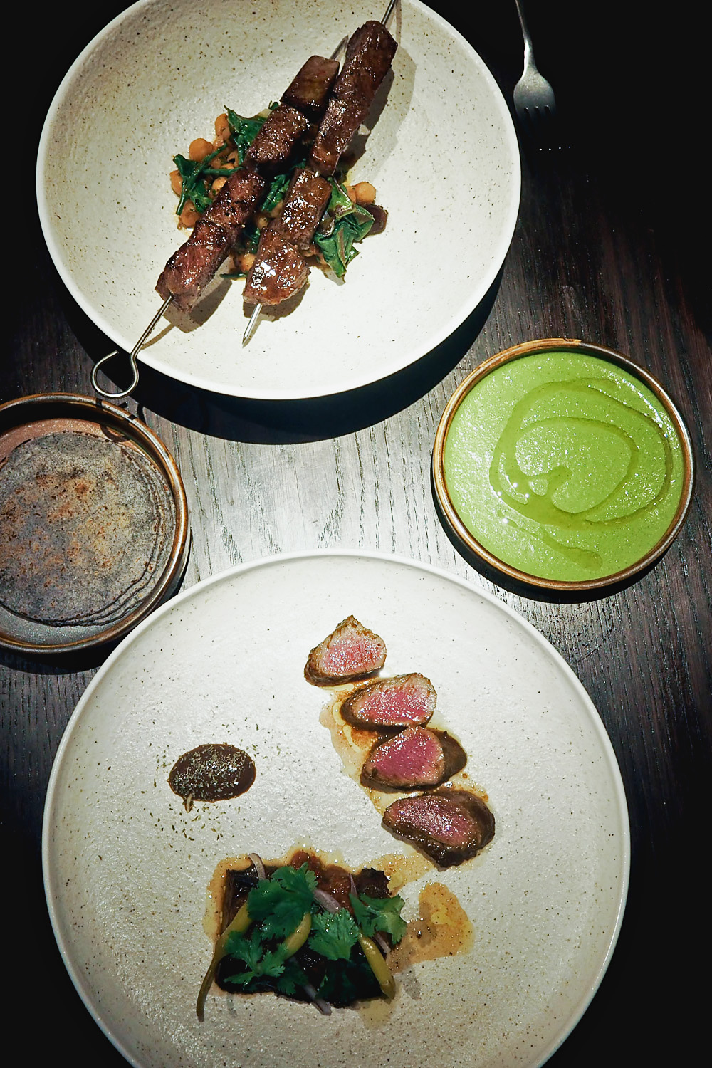 Sirloin steak served with spiced chickpeas and Swiss chard and Lamb in adobo with salad of herbs and guindillas | YOPO restaurant, The Mandrake Hotel, Fitzrovia London | Mondomulia